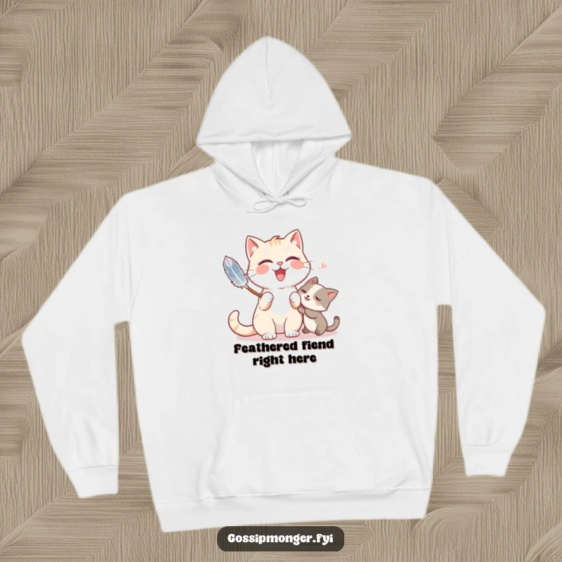 Funny hoodie featuring a giggling cat playfully tickling a friend with a feather duster, exuding lighthearted fun.