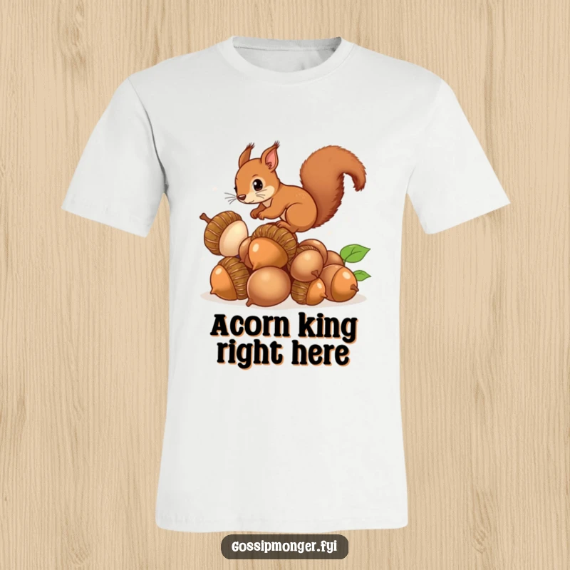 Funny Squirrel Acorns T-Shirt: A curious brown squirrel with a bushy tail balances atop a mountain of enormous, shiny acorns.