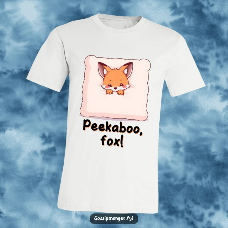 Funny t-shirt depicting a tiny kawaii fox peeking out from behind a large, soft pillow, looking cute and a little bashful.